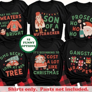 May include: Black graphic t-shirts with Christmas-themed phrases and illustrations. Designs include a sweater, nutcracker, Santa, and gift-themed characters. The text includes phrases like "May all your sweaters be ugly and bright" and "Gangsta Wrapper."