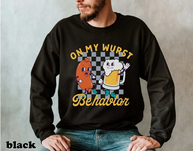 May include: Black sweatshirt with a graphic of a cartoon sausage and beer mug. The text "On My Wurst Behavior" is printed on the shirt.