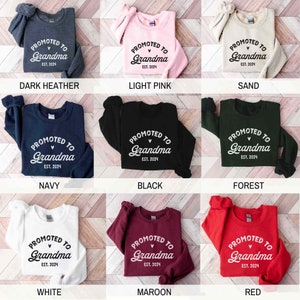 May include: Nine different color crew neck sweatshirts with the text "PROMOTED TO Grandma EST. 2024" in a white script font.