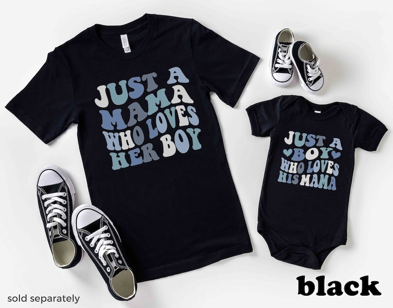 May include: Black t-shirt with the text "Just a Mama Who Loves Her Boy" in blue and white lettering. A matching black bodysuit with the text "Just a Boy Who Loves His Mama" in blue and white lettering.