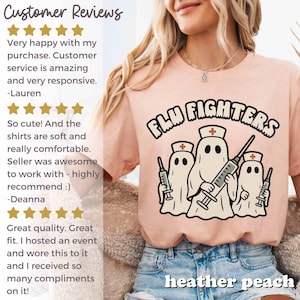 May include: Peach-coloured t-shirt featuring the words "Flu Fighters" and a graphic of three ghost figures wearing nurse hats and holding syringes. The shirt also has customer reviews.