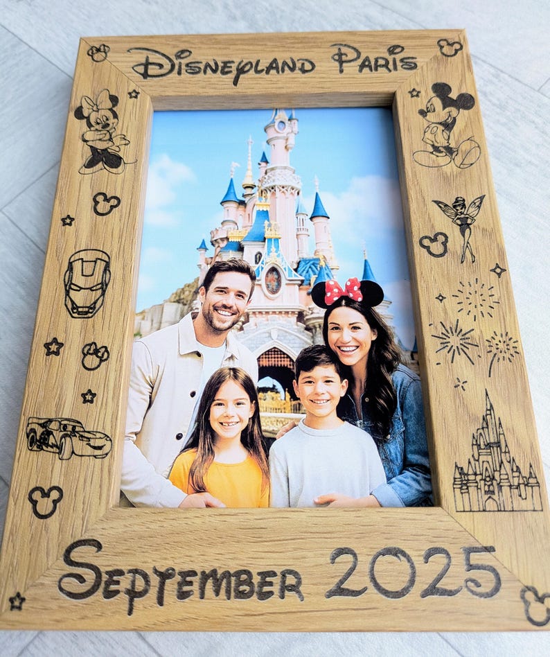 May include: Wooden photo frame with "Disneyland Paris" and "September 2025" text. The frame features Disney character illustrations and a family photo in front of a castle.