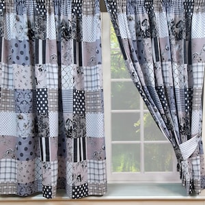 May include: A pair of grey and white patchwork curtains with a floral pattern. The curtains are hung on a window with a white frame.