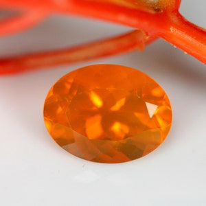 1.36 Carats! Natural Mexican Fire Opal Faceted. 9x7 MM Oval Shape. Orange Color. Calibrated Size. Loose Gemstone.