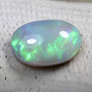 1.83 Carats! Natural Australian Opal. 10x7 MM Oval Shape. Ring Size. Gray Base Opal. Earth Mined Stones. Blazing Multi Fire.