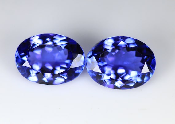 3.71 Carat Deep Color Tanzanite Pair Faceted Oval Shape 9x7mm Size. Eye Clean to Loupe Clean Quality. Loose Gemstone.