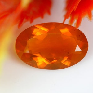 1.53 Carats! Natural Mexican Fire Opal Faceted. 12x7 MM Oval Shape. Orange Color. Calibrated Size. Loose Gemstone.