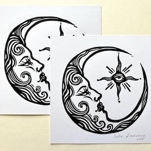 May include: Two black and white prints of a crescent moon with a stylized human face and a star with an eye in the center. The bottom print is signed "Sofia Liasletouva 2025".
