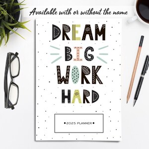 May include: A white planner with black polka dots and the text "DREAM BIG WORK HARD" in black with colorful accents. The planner has a space for a name and says "2025 PLANNER" at the bottom.