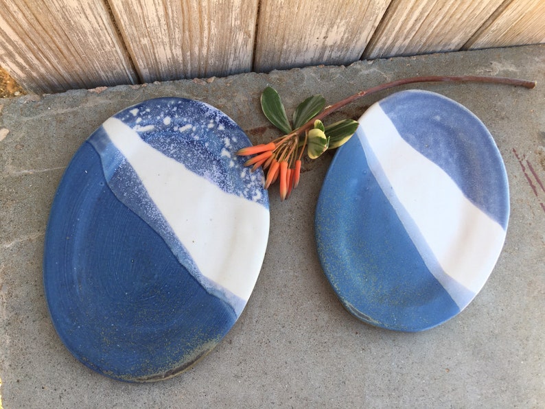 Set of 2 Oval pottery side plates. Ocean design blue and white