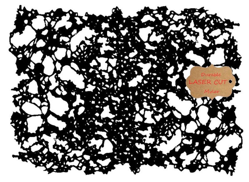 May include: Black laser-cut mylar stencil with a complex, organic pattern of interconnected shapes. The stencil has a durable design and includes a brown tag with the words "Durable Laser Cut Mylar".