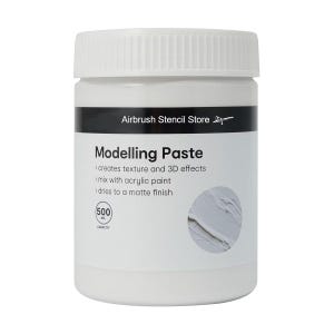 May include: A white plastic jar of modelling paste with a black label that reads "Airbrush Stencil Store" and "Modelling Paste". The label also includes instructions for using the paste, such as mixing it with acrylic paint and drying to a matte finish. The jar is 500 ml.