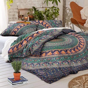 May include: A blue and green mandala patterned duvet cover with matching pillowcases. The duvet cover features a large circular mandala design with intricate details and elephants.
