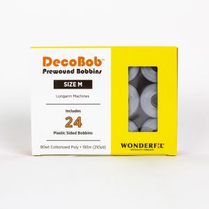 May include: A yellow and white box of DecoBob prewound bobbins, size M, for longarm machines. The box includes 24 plastic-sided bobbins with 193m (210yd) of 80wt cottonized poly thread. A window reveals the bobbins.