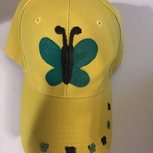 Brand New Yellow Baseball Cap With  Hand Painted Jamaican Color Butterfly to Front. Mini Rhinestone Butterfly to Rim.