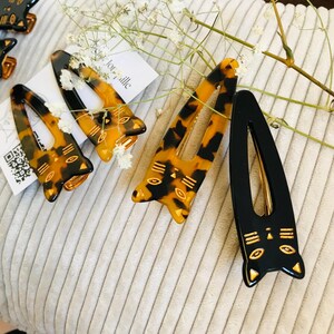 ?CHANEL Black and Tan Polka Dot Hair Clip ✨ Bow-detail polka-dot hair clip in black - Prada | Mytheresa main image 3