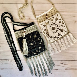 May include: Two crocheted bags with fringe, one in black and green, the other in beige and white. Both bags have wooden beads and tassels.
