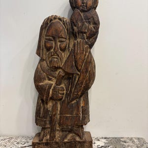 Hand carved wood folk art sculpture.