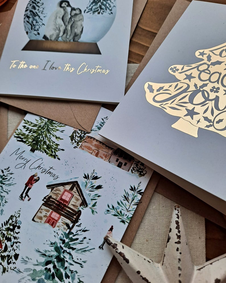 close up of three christmas cards