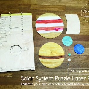 May include: A set of laser cut wooden puzzle pieces depicting the planets in our solar system. The pieces are painted in realistic colors and include the sun, Mercury, Venus, Earth, Mars, Jupiter, Saturn, Uranus, and Neptune. The puzzle pieces are arranged on a wooden surface. The text "Solar System Puzzle Laser Plans" and "Lasercut your own accurately scaled solar system model!" is printed below the puzzle pieces.