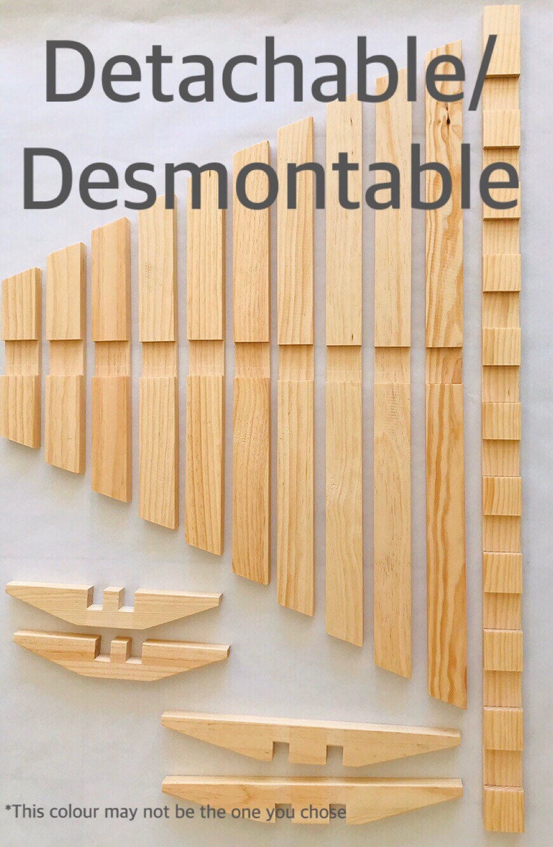May include: A set of wooden pieces for building a chair. The pieces are labeled "Detachable/Desmontable". The pieces are all natural wood color.