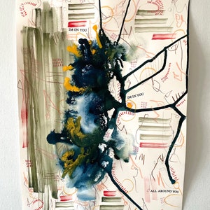 May include: Abstract painting with black, blue, and yellow paint splatters on a white background. The painting includes the text "IM ON YOU", "IM IN YOU", and "ALL AROUND YOU".