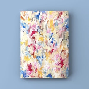 May include: Abstract painting with a colorful, textured, and layered design. The painting features shades of pink, blue, yellow, and white.