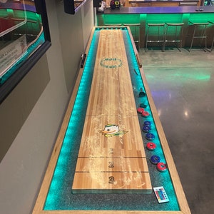 True North Shuffleboard Tables, 9' to 17' lengths. Hardtop covers, LEDs, and custom surfaces available. Includes delivery to continental US.