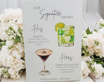 May include: A white sign with the text "Our Signature Drinks" and illustrations of two cocktails. The text "His" is above a mojito cocktail and the text "Hers" is above an espresso martini cocktail. The sign also includes the text "Sophie & James - 05.07.2024".