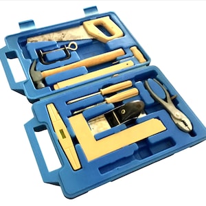 May include: A blue toolbox with an assortment of hand tools, including a saw, hammer, screwdrivers, and pliers. The tools have wooden handles and are neatly organized within the case. The toolbox is open, displaying the tools.