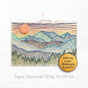 May include: A digital download string art DIY kit featuring a mountain landscape with a sunset and trees. The difficulty level is rated as challenging, 5 out of 5.