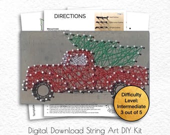 May include: A red string art truck carrying a green Christmas tree, with white nail heads. The kit includes directions and a difficulty level of intermediate. The text "Digital Download String Art DIY Kit" is at the bottom.