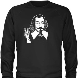 May include: Black and white illustration of a man with a moustache and beard, wearing a collared shirt and giving a peace sign. The illustration is on a black sweatshirt.