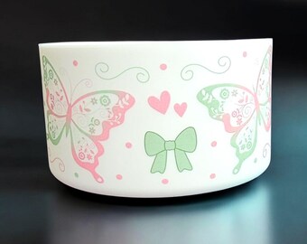Pink and Green Butterflies, Coquette Bows, and Hearts on a White Silicone Tumbler Boot. Fits Stanley, Simple Modern, Brumate Tumblers.