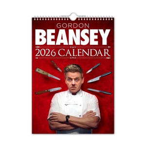 May include: A 2026 calendar featuring Gordon Ramsay with knives radiating from his head. The calendar has a red background with the name "Gordon BEANSEY" in large white letters. Ramsay is wearing a chef's coat and a watch.