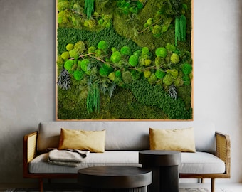 May include: A framed moss wall art piece with a variety of green moss textures and shades. The moss is arranged in a natural, organic pattern, creating a visually appealing and calming effect. The frame is a simple, light wood color.