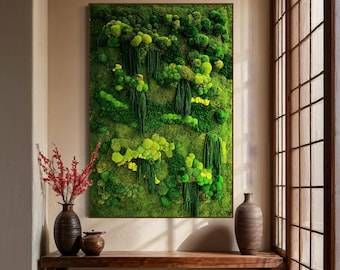 May include: A green moss wall art piece in a wooden frame hangs on a beige wall in a room with a wooden bench and a vase of red flowers. The wall art is made of preserved moss and features a variety of textures and shapes.