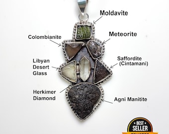 May include: A silver pendant featuring various gemstones, including Moldavite, Meteorite, and Herkimer Diamond. The pendant has a unique, irregular shape and is labeled with the names of the stones. The pendant is marked as a "Best Seller" and "Trusted".