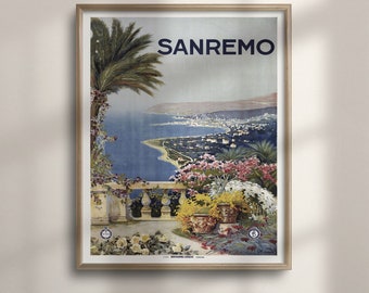 May include: Vintage travel poster advertising Sanremo, Italy. The poster features a scenic view of the city from a hillside, with a palm tree in the foreground and a blue ocean in the background. The text "SANREMO" is printed in bold blue letters at the top of the poster.