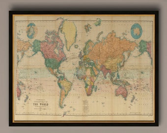 May include: A vintage world map in a black frame with a gold mat. The map is printed on a cream-colored paper with a grid pattern. The continents are colored in shades of green, yellow, red, and brown. The map includes the text "Stanford's Library Map of The World".