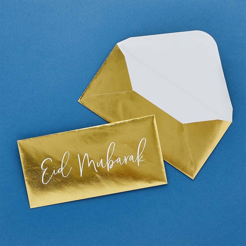 May include: Gold envelope with a white interior and the text "Eid Mubarak" printed in white on the front.
