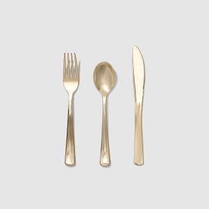 May include: A set of three gold-coloured plastic utensils: a fork, a spoon, and a knife.
