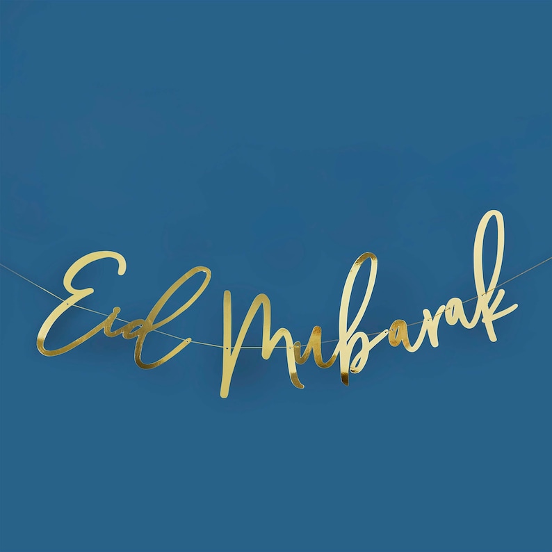 May include: Gold foil banner with the text "Eid Mubarak" on a blue background.