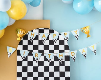 May include: A blue and gold "Happy Birthday" banner with a checkered pattern on each flag. The banner is strung between two gold trophy-shaped decorations. The banner is hanging against a light blue background.
