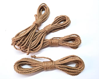 May include: Three spools of natural brown twine rope. The rope is made from natural fibres and is ideal for crafting, gardening, and other DIY projects.