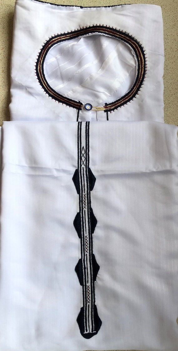 Kanzu Uganda's traditional wear for young people in White