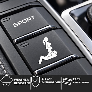 May include: A white vinyl decal featuring a graphic silhouette of two figures in a sexual position, applied to a black car interior button labeled SPORT. The decal is weather resistant, made of 6-year outdoor vinyl, and designed for easy application.
