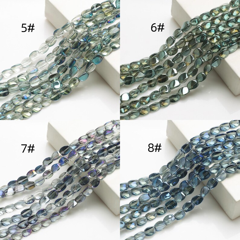 Pode incluir: Close-up de quatro conjuntos de contas de vidro ovais em tons de azul, verde e cinza. Cada conjunto &eacute; rotulado com um n&uacute;mero: 5#, 6#, 7# e 8#. As contas t&ecirc;m um acabamento brilhante, adequadas para fazer joias.