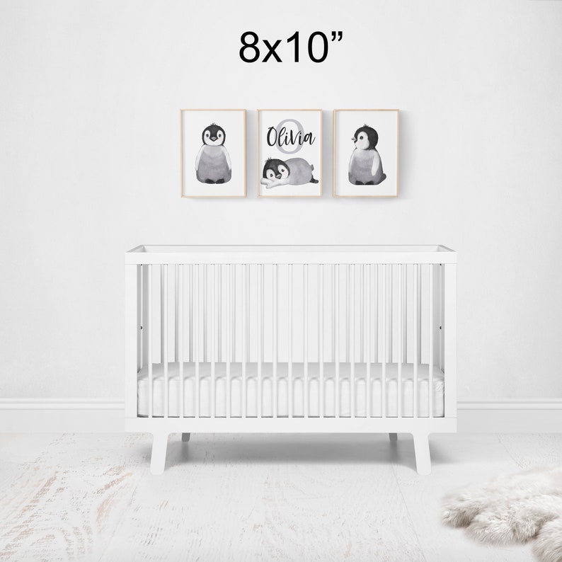 May include: Three 8x10 inch prints featuring black and white watercolor illustrations of penguins. The center print includes the name "Olivia" in a circle.
