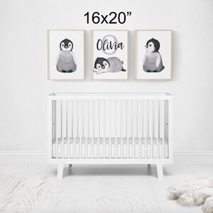 May include: Three black and white penguin illustrations in 16x20 inch frames. The center frame features the name "Olivia" in a circle with a penguin inside.